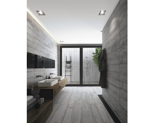 Salle de bain lumineuse avec double vasque, douche et carrelage gris