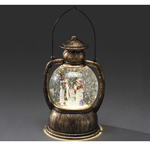 Lanterne boule à neige avec famille bonhomme de neige