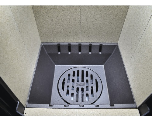 Revêtement de foyer avec grille en fonte