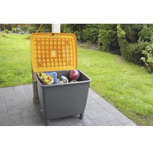 Coffre de rangement pour extérieur avec couvercle ouvert, rempli de jouets