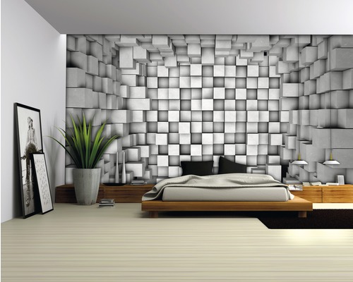 Chambre avec un lit et un revêtement mural à motif de cubes
