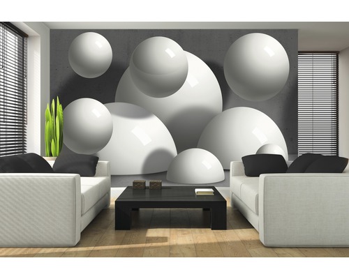 Salon lumineux avec canapé, table et papier peint photo avec motifs de boules