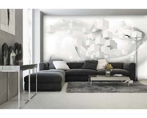 Salon avec canapé gris, tapis et papier peint photo avec un motif de cubes blancs