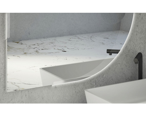 Miroir de salle de bains rond et lumineux avec un design moderne au-dessus d''un lavabo.