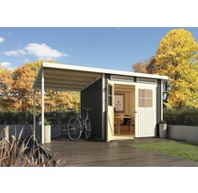 Abri de jardin avec abri et vélos dans le jardin