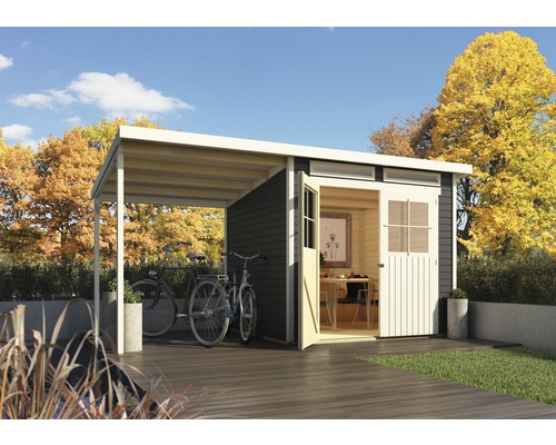 Abri de jardin avec abri et vélos dans le jardin