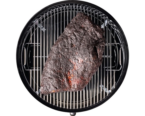 Ein Stück Fleisch auf einem Grill.