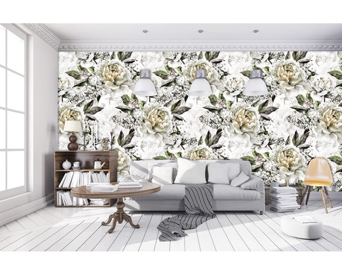 Salon lumineux avec un papier peint photo à motifs floraux, des meubles et des éléments décoratifs.