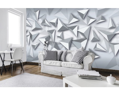 Salon avec un canapé blanc et un papier peint photo géométrique avec des triangles en trois dimensions
