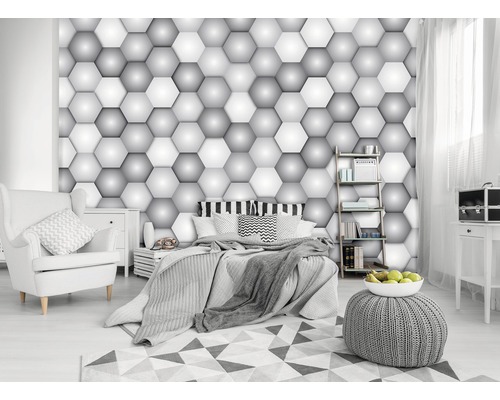 Chambre avec papier peint hexagonal en trois dimensions et meubles