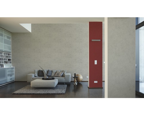 Wohnzimmer mit Sofa, Ottomane und dekorativen Elementen in einem hellen, modernen Design.