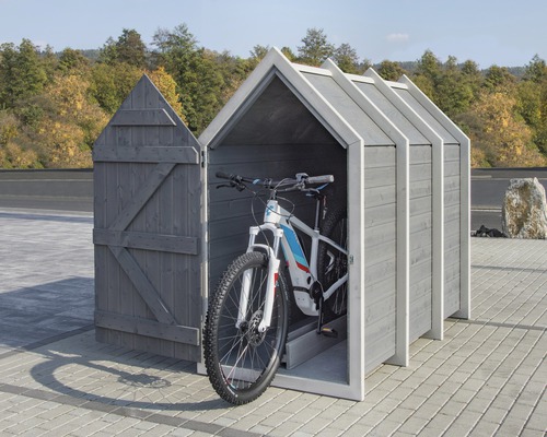 Garage à vélos en bois avec porte ouverte et vélos