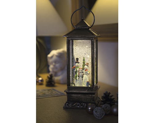 Lanterne décorative avec famille de bonhommes de neige et paillettes de neige pour une ambiance de Noël