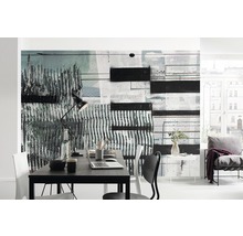 Bureau moderne avec une peinture murale abstraite, un bureau et une chaise.