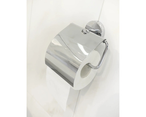 Porte-papier toilette avec rouleau de papier sur un mur de salle de bain