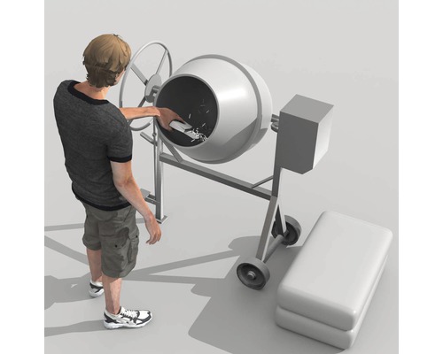 Mann befüllt Betonmischer mit Schaufel und Zementsack.