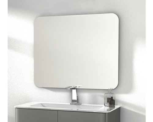 Miroir rectangulaire avec coins arrondis au-dessus d''un lavabo dans une salle de bain