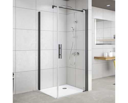 Cabine de douche avec cadre noir et robinetterie de douche dans la salle de bain
