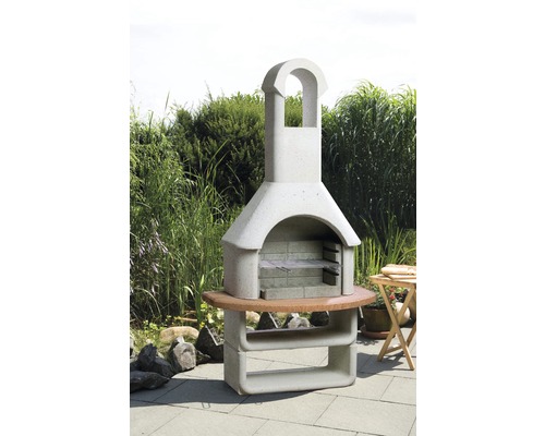 Cheminée de barbecue de jardin en pierre avec table en bois et étagère