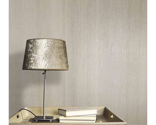 Papier peint texturé à côté d''une lampe et de livres sur une table