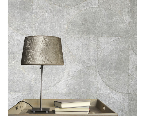 Papier peint décoratif avec motif de cercle, lampe de table et livres sur une table