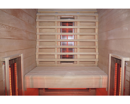 Intérieur d''un sauna infrarouge avec lambris en bois et banc