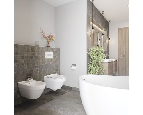 Salle de bains moderne avec bidet, toilettes et baignoire