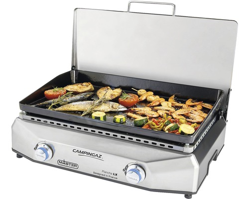 Grill à gaz Campingaz avec des aliments grillés