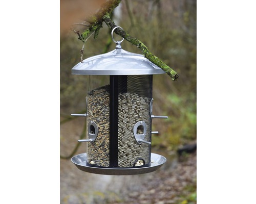 Vogelhaus mit Futter zum Aufhängen an einem Ast