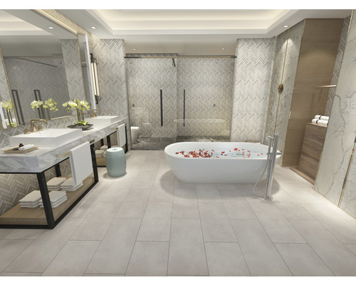 Salle de bain lumineuse avec baignoire, lavabos et douche.