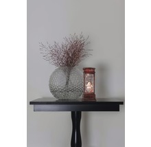 Vase à fleurs décorative avec fleurs séchées et boule à neige sur une table