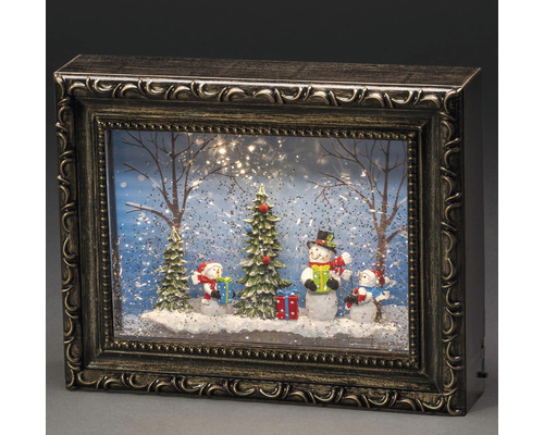 Boule à neige décorative avec motif bonhomme de neige dans un cadre photo