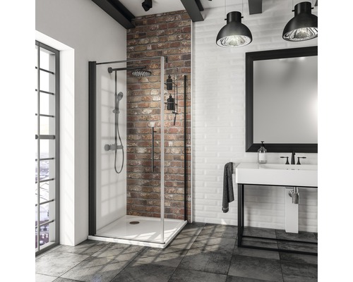 Salle de bain moderne avec cabine de douche, lavabo et miroir dans un style loft