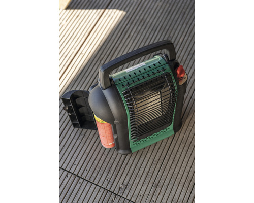 Radiateur à gaz portable vert et noir sur fond en bois