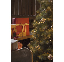 Sapin de Noël avec lumières, cadeaux et sac à cadeaux