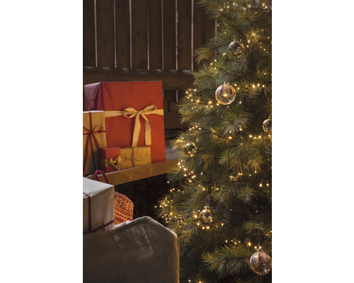 Sapin de Noël avec lumières, cadeaux et sac à cadeaux