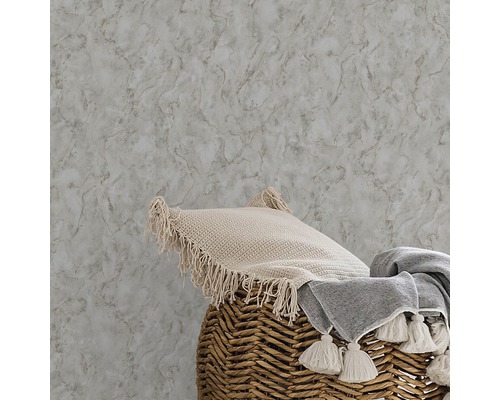 Papier peint imitation marbre avec coussin et couverture dans un panier