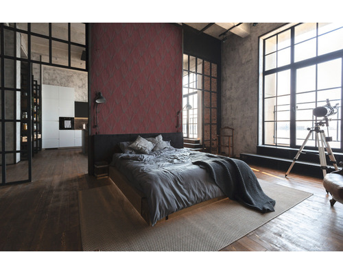 Chambre claire de style loft avec lit, tapis et grande fenêtre