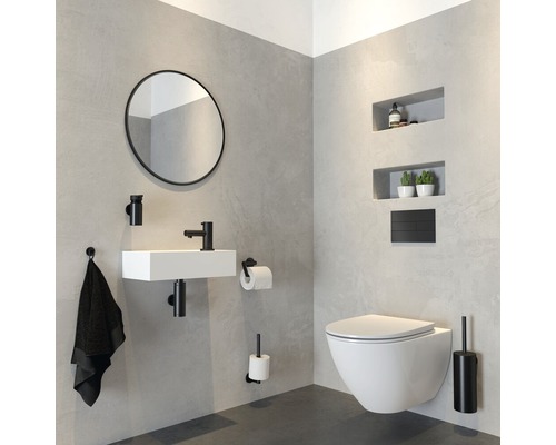 Modernes Badezimmer mit Waschtisch, Spiegel, Toilette und Accessoires in Schwarz und Weiss