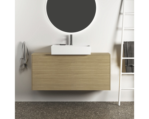 Salle de bains moderne avec meuble sous-lavabo, vasque à poser, robinetterie et miroir rond