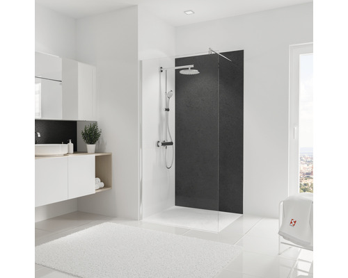 Salle de bain lumineuse avec cabine de douche, lavabo et tapis blanc