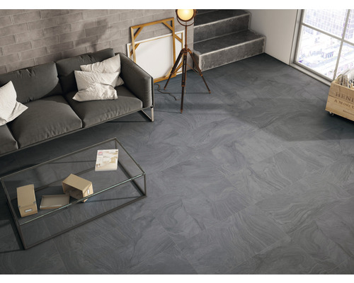 Salon moderne avec carrelage de sol gris, canapé et table basse