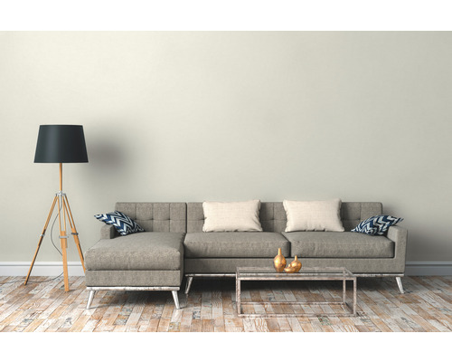 Wohnzimmer mit Ecksofa, Stehlampe und Couchtisch