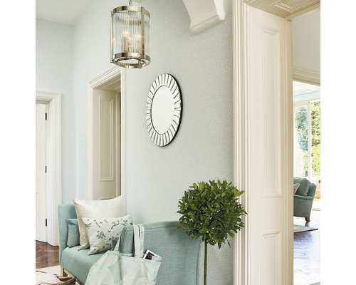 Entrée avec banc, miroir rond, suspension et plante d''intérieur