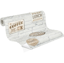 Rouleau de papier peint avec motif de briques et inscriptions