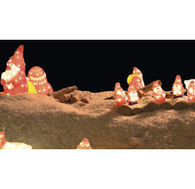 Scène de Noël décorative avec des figurines illuminées et du bois