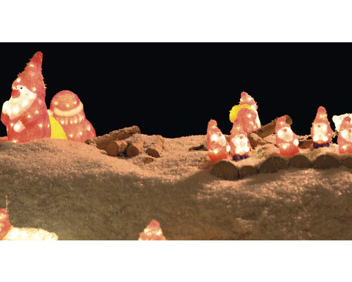 Scène de Noël décorative avec des figurines illuminées et du bois