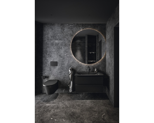 Salle de bain moderne avec WC, lavabo et miroir rond