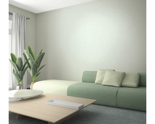 Salon avec canapé, table et plantes d''intérieur pour une ambiance lumineuse et conviviale.