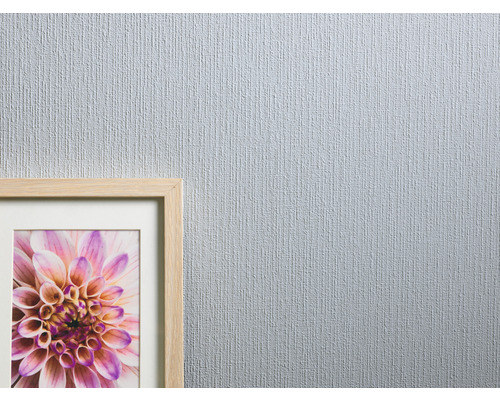 Papier peint avec une texture fine et une image avec un motif floral